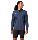 Front view of model wearing the CNO IMM Men's Brooks Dash 1/2 Zip in Blue Slate